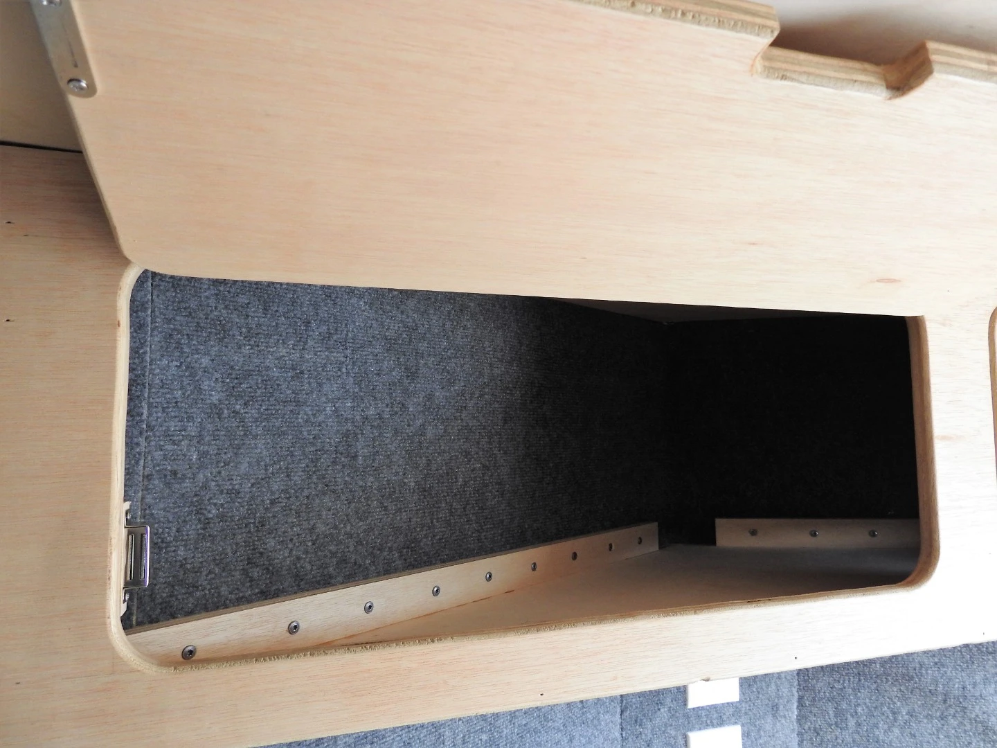 The insulated interior includes front nose cabinetry