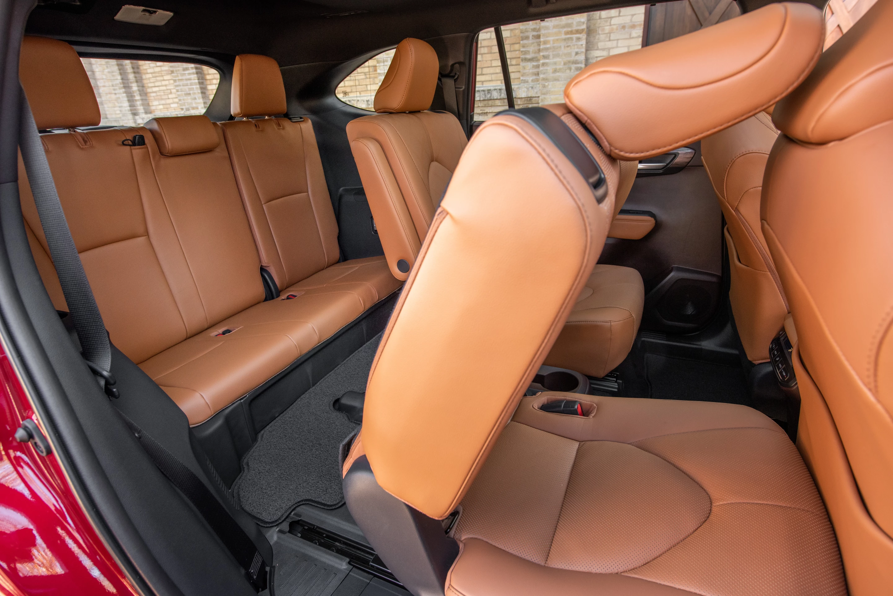 Access to the third row in the 2020 Highlander Hybrid is difficult, and the third row is cramped