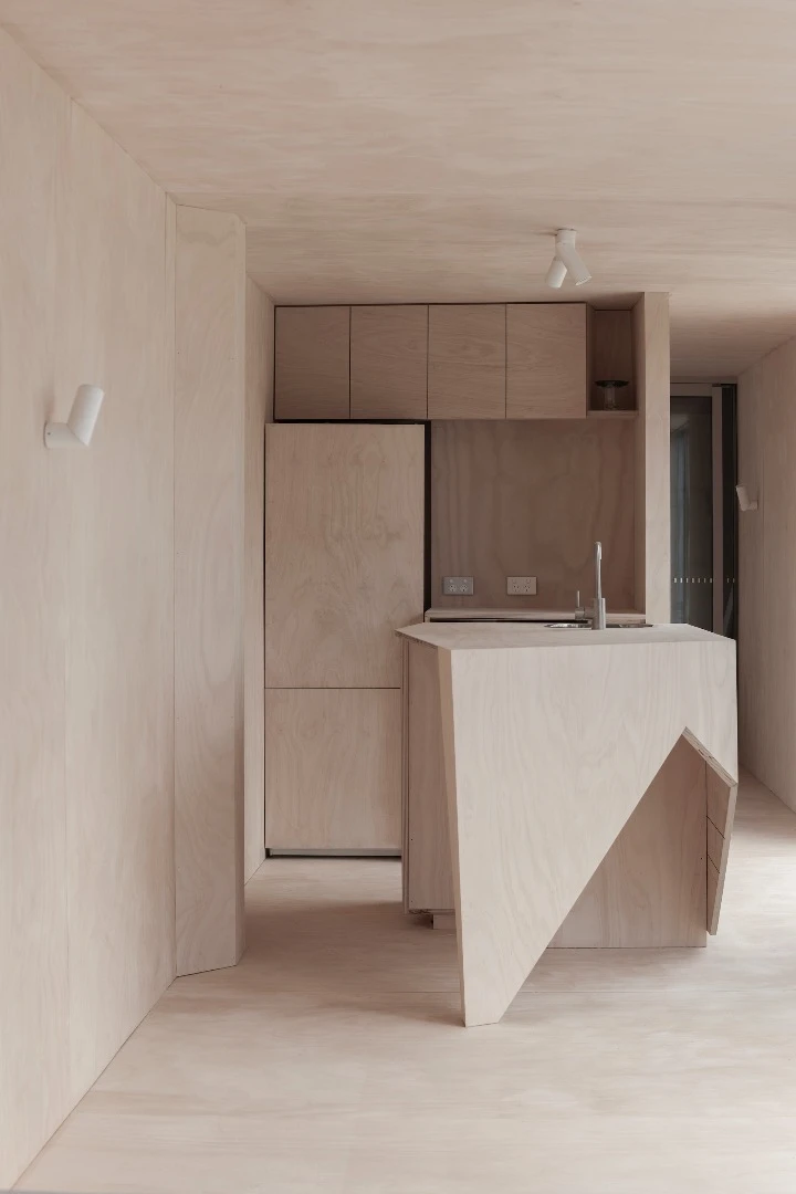 House 28's plywood furniture includes a kitchen area and two toilets
