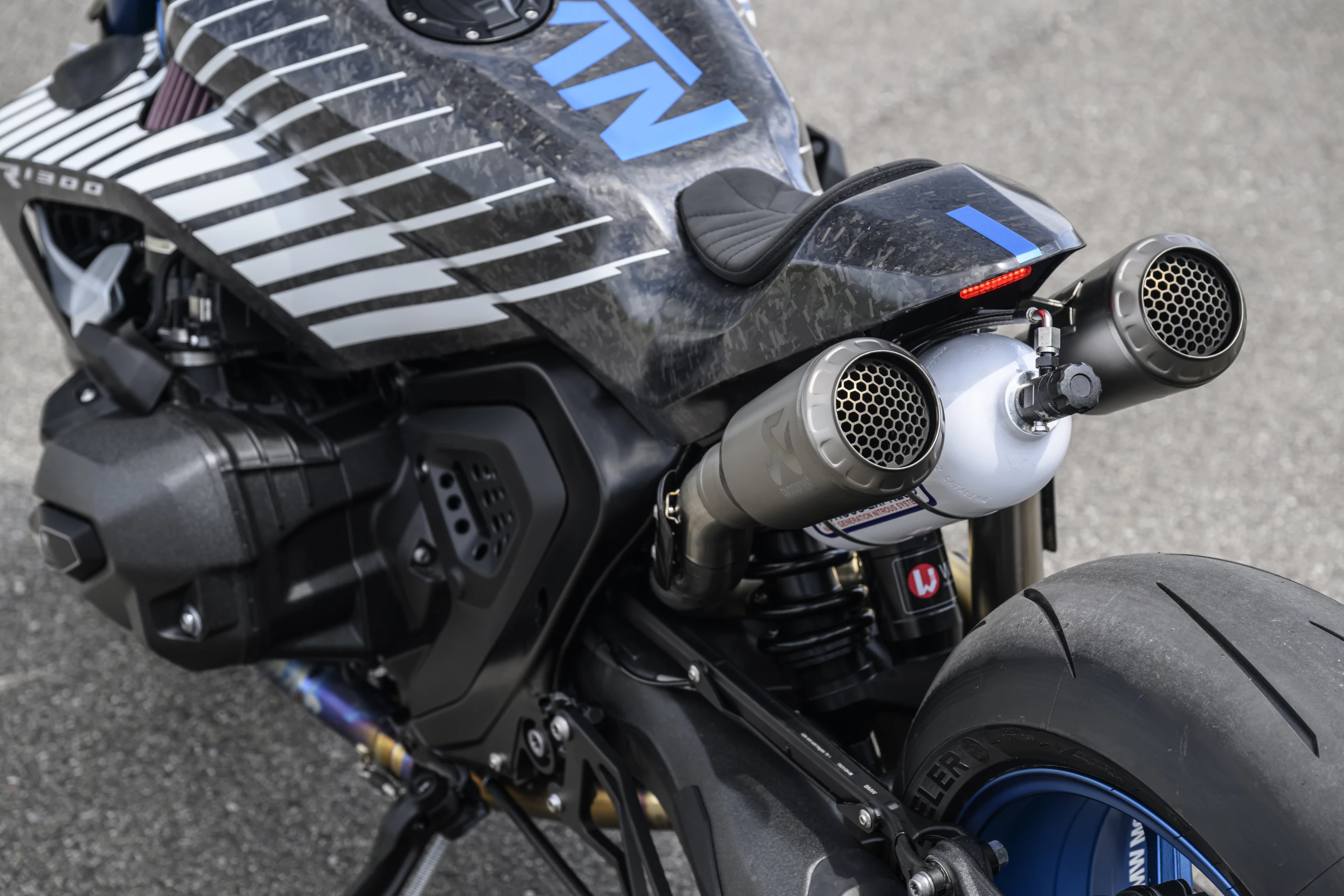 A can of nitrous sits between the two rear titanium silencers