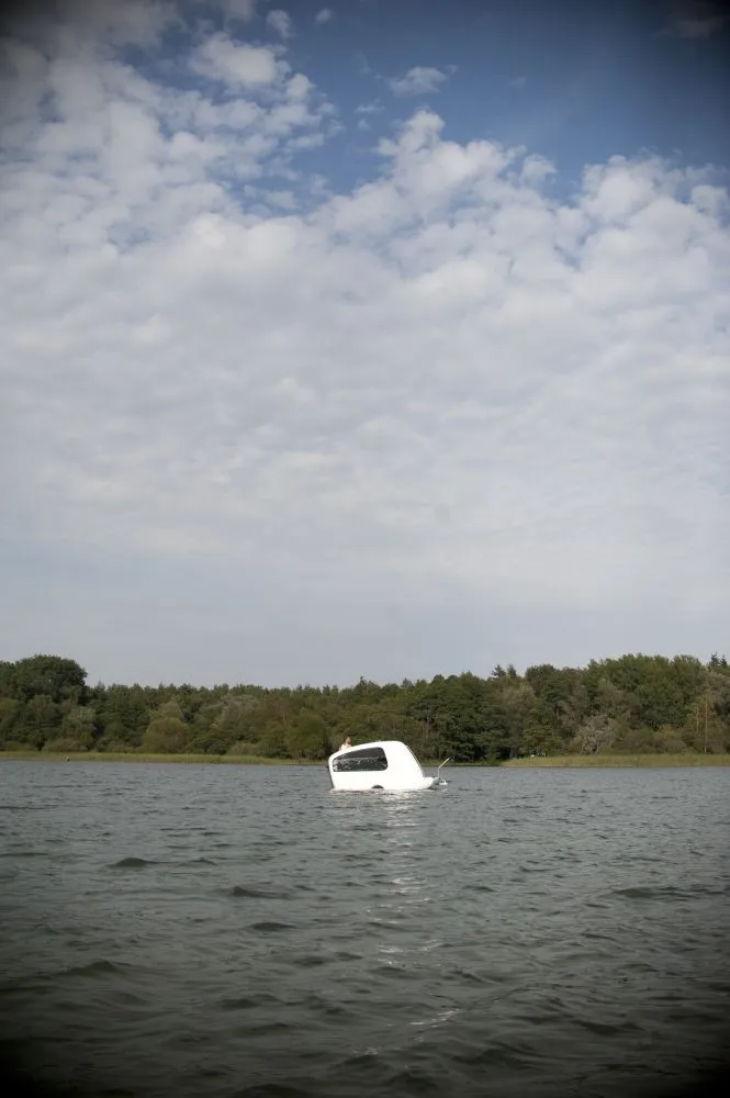 Its shell is made of fiberglass reinforced plastic, with double bottom to prevent sinking in case of a leakage
