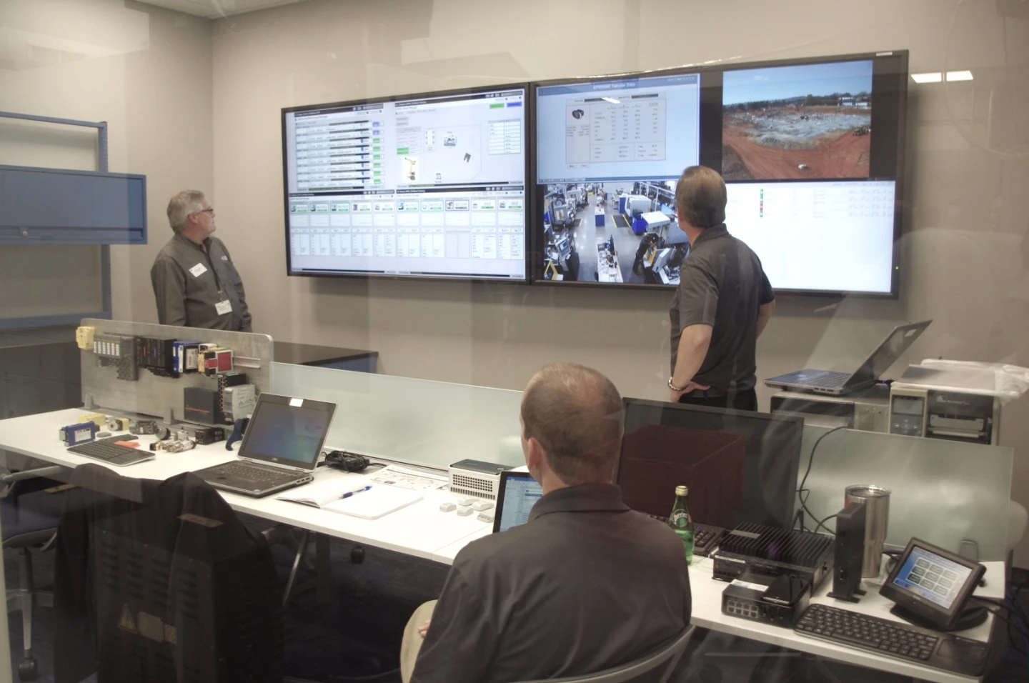 GE workers monitoring the factory's machines which are connected using an Internet of Things approach