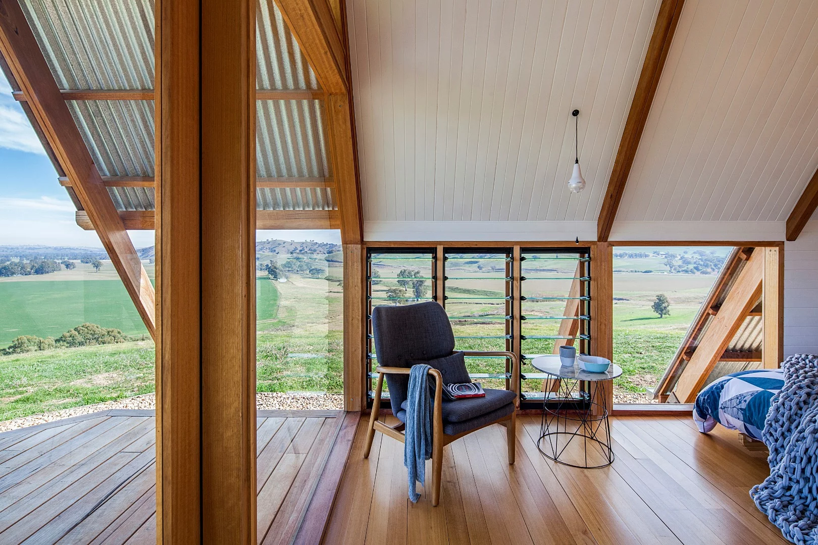 Inside the solar-powered JR's Hut is a bed for two, bathroom with a view and freestanding wood burner fireplace