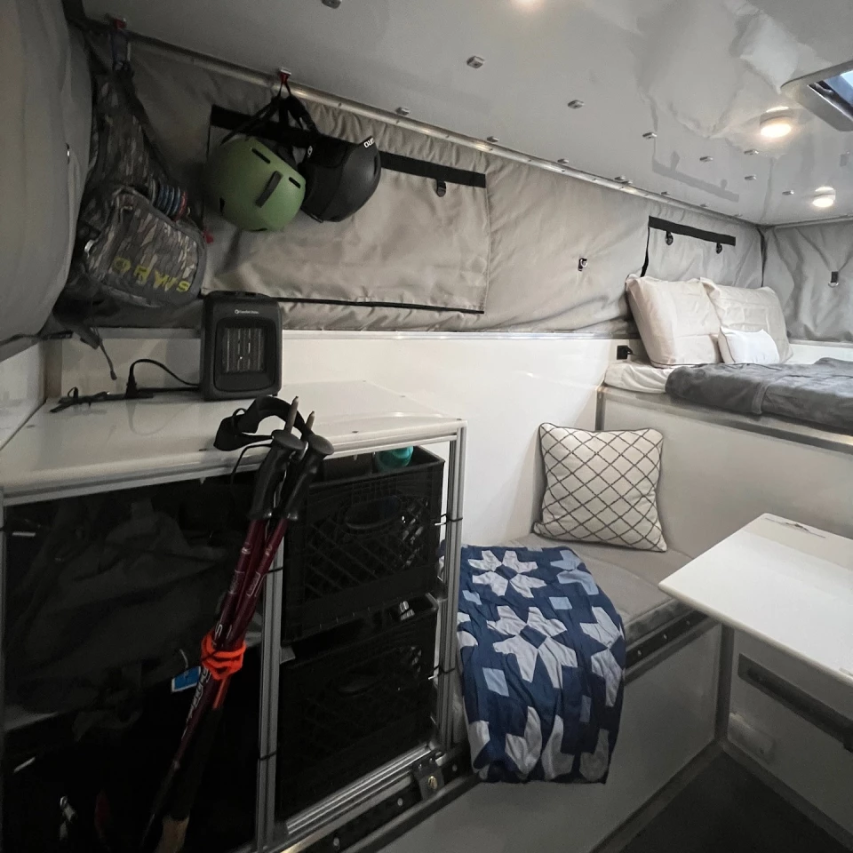 Shown here on the Stealth pop-top, the little metal studs lining the ceiling are the "Modu-Lok" hardware that allows for moving, securing and rearranging both Peak's modules and the buyer's own storage and living accessories