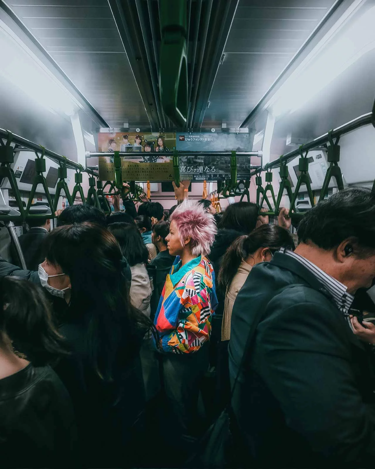 Finalist in ‘The Street Photographer’ category. A splash of color on a Tokyo train.