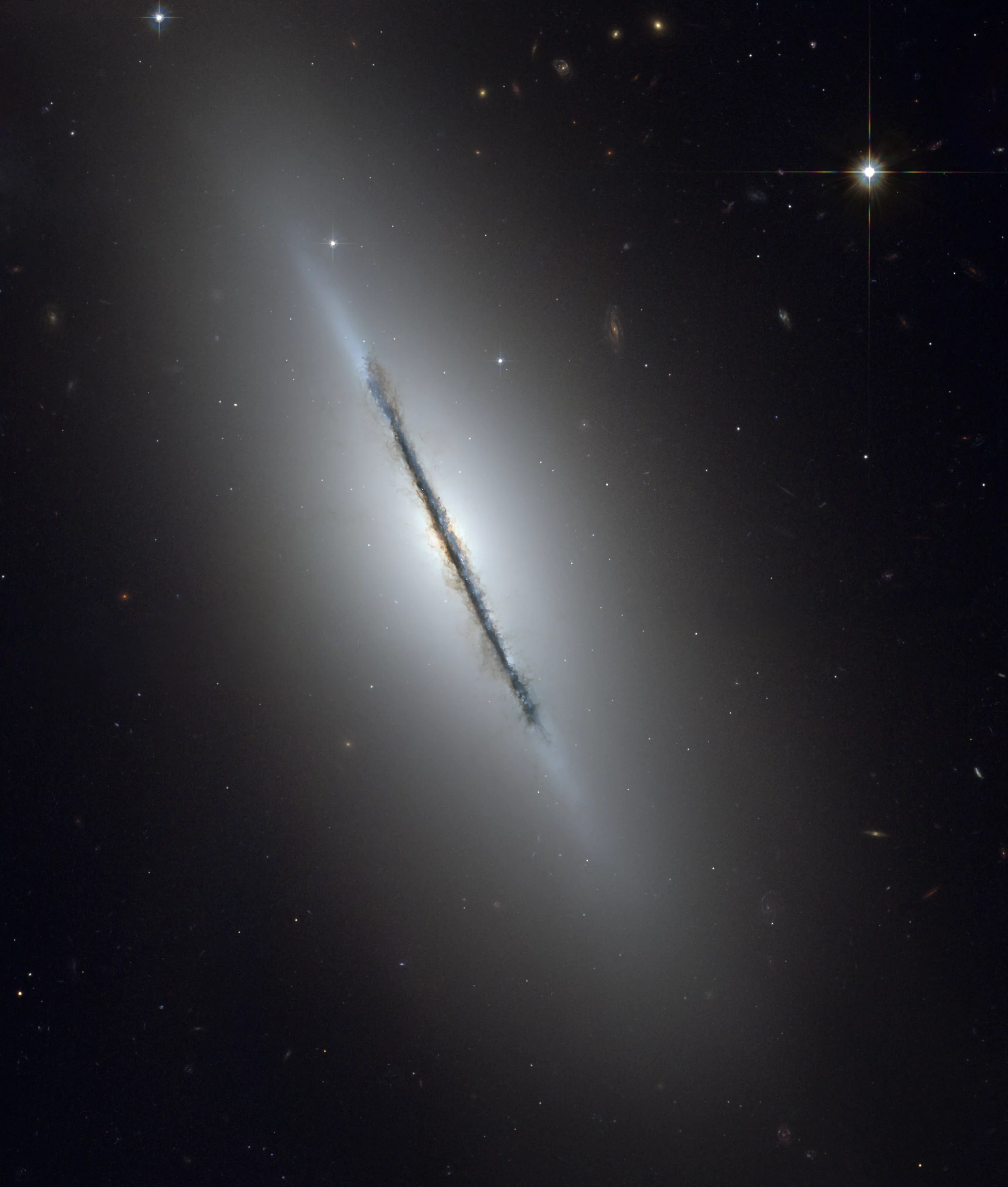 Hubble image of the Spindle galaxy (M102), imaged almost edge on from the telescope