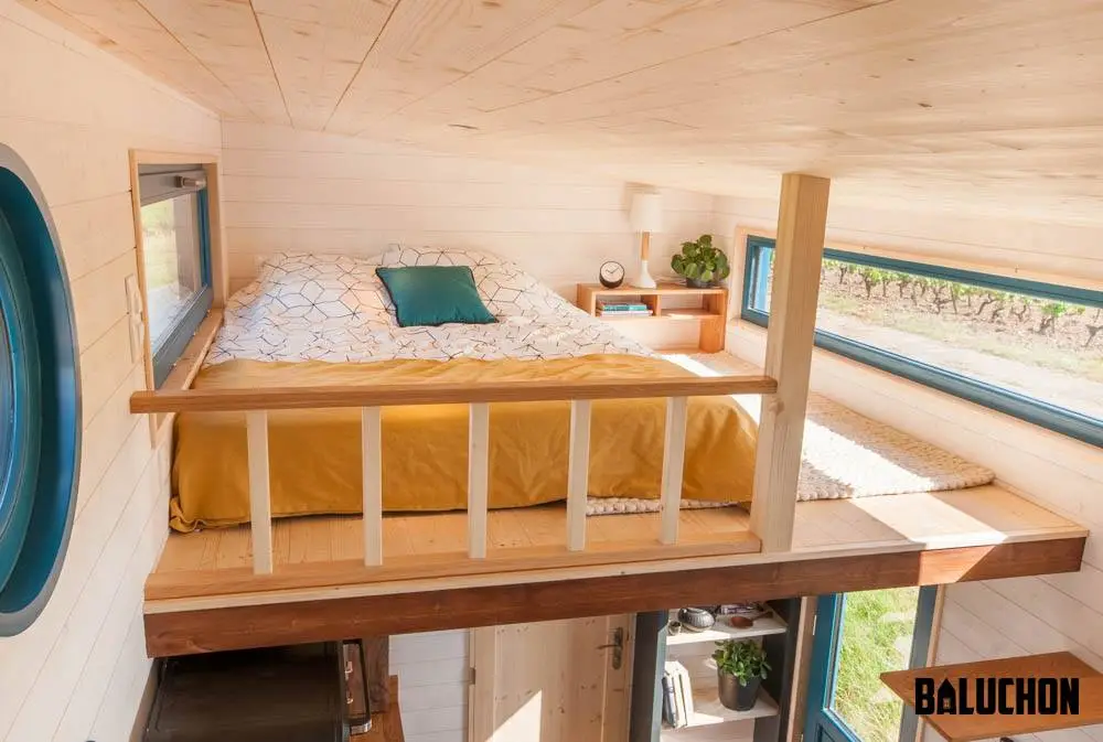 The Valhalla's main bedroom is a typical tiny house loft-style bedroom and includes a double bed