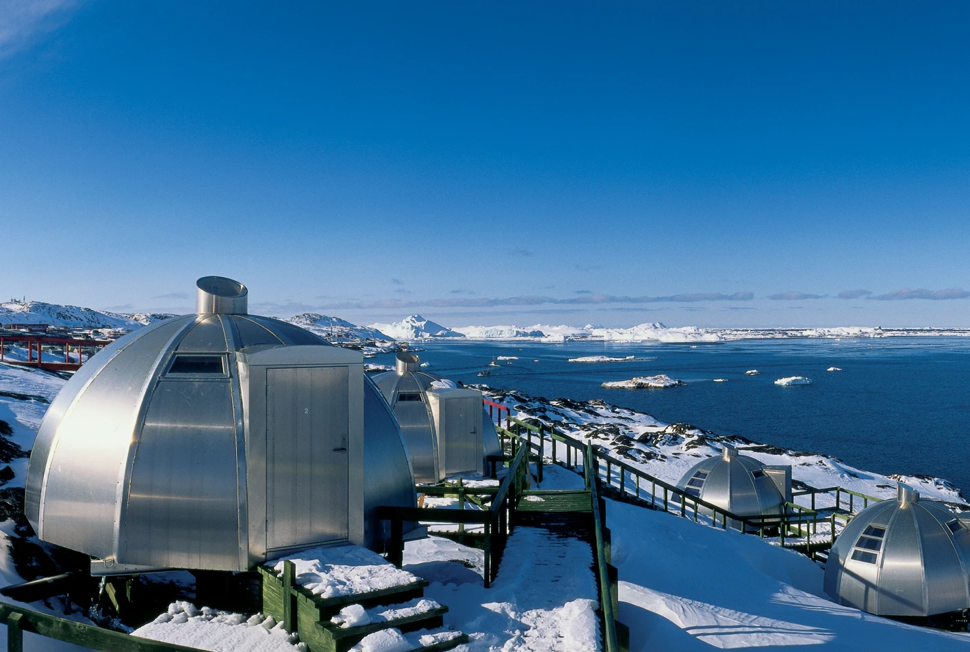In Greenland on the edge of a giant fjord is Hotel Arctic, the world's most northerly hotel, where you can stay in strange aluminum igloos