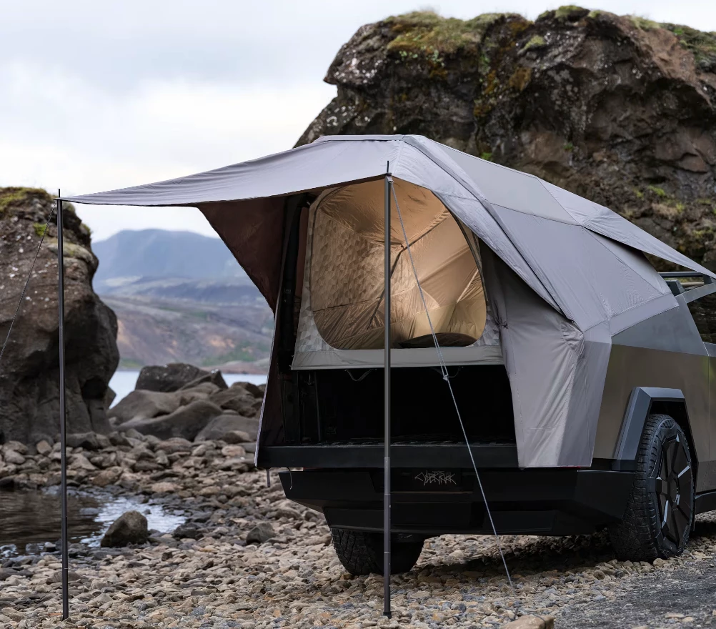 The official Tesla Basecamper features a unique design that's not quite a rooftop tent, not quite a basic pickup tent, but something in between