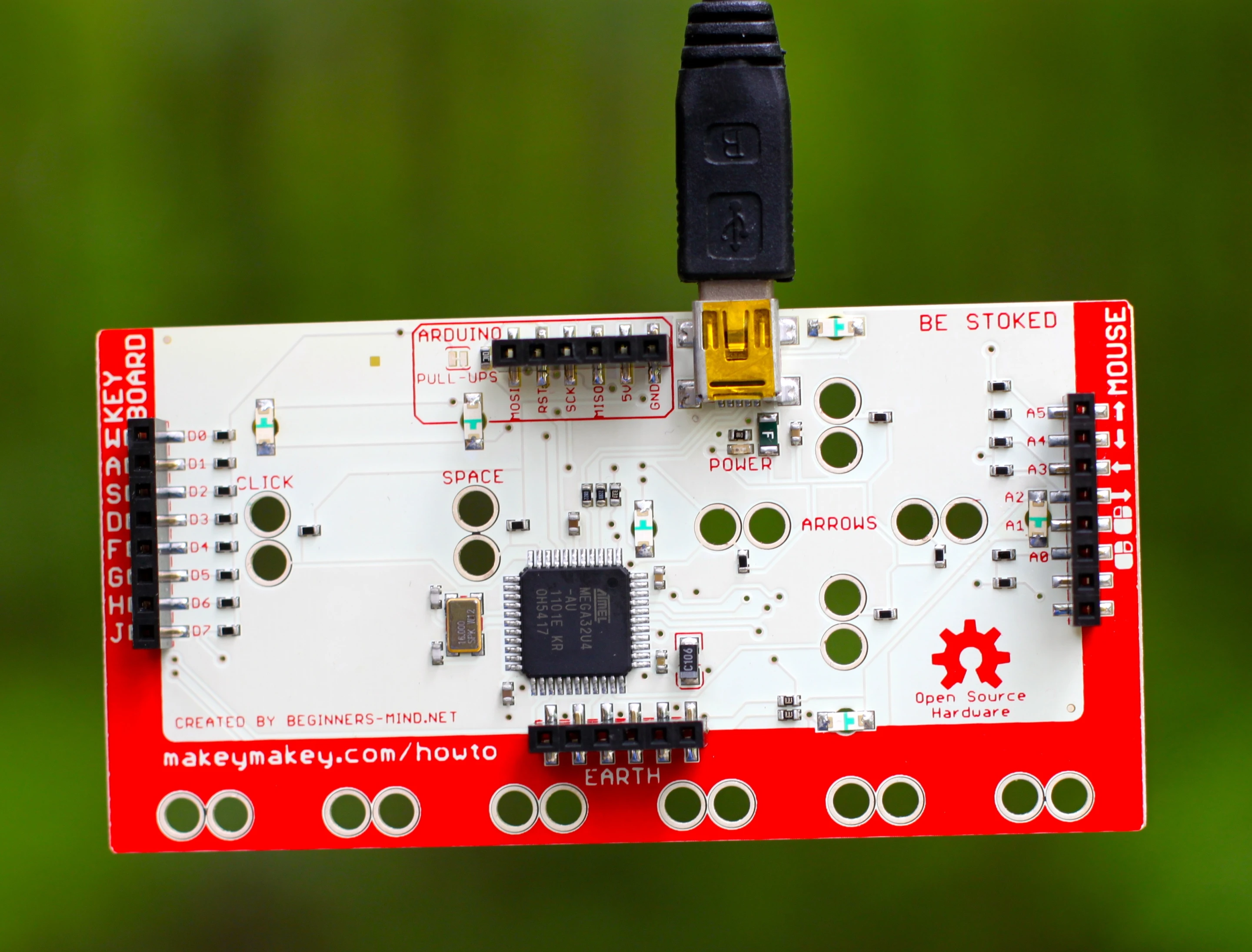 The back of the third Makey Makey prototype, showing 12 more inputs and Arduino connections
