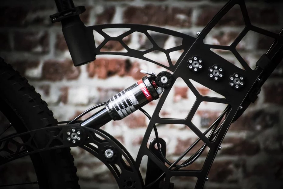 The Bees Bike features a modular design that lets you switch out the rear shock for a solid bar, going from full-suspension to hardtail on the same bike