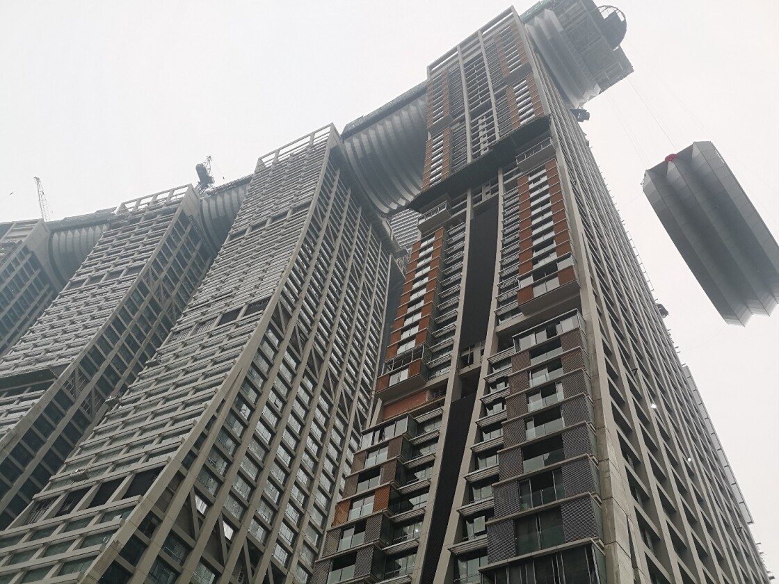 The Raffles City Chongqing's skybridge being hoisted into position