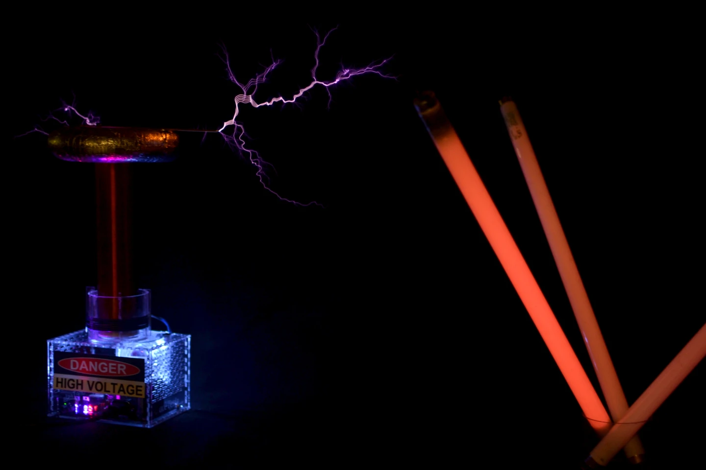 Exploring wireless power transfer by placing fluorescent tubes near a Tesla coil