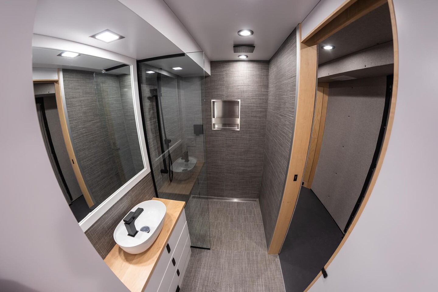 Looking at the dry bathroom shower with rainfall head mounted on the ceiling