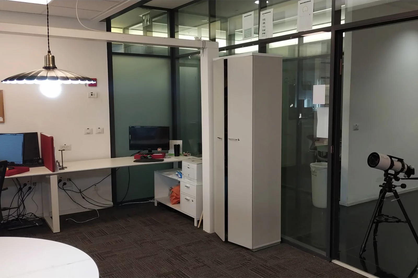 The research setup, with a telescope aimed at a light bulb