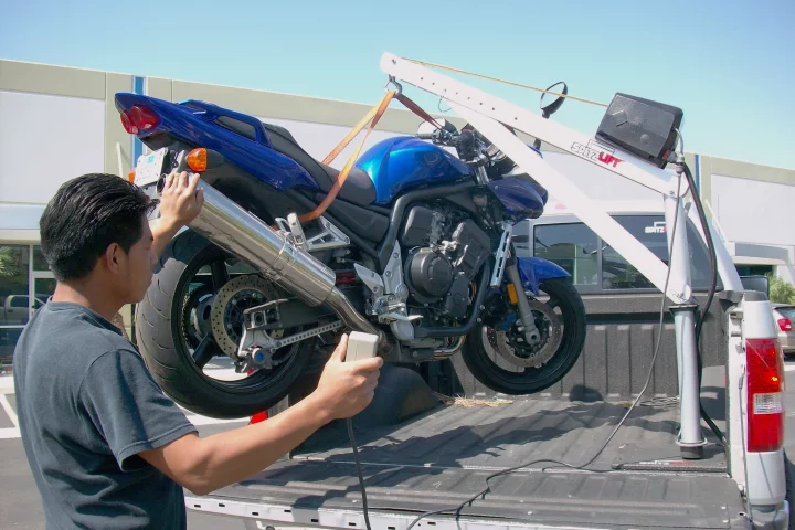 Spitzlift's miniature cranes make lifting a bike into a truck easy