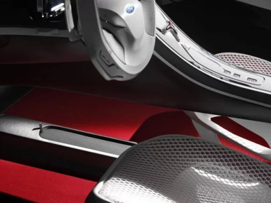 The white mesh fabric is offset with warm red carpeting.