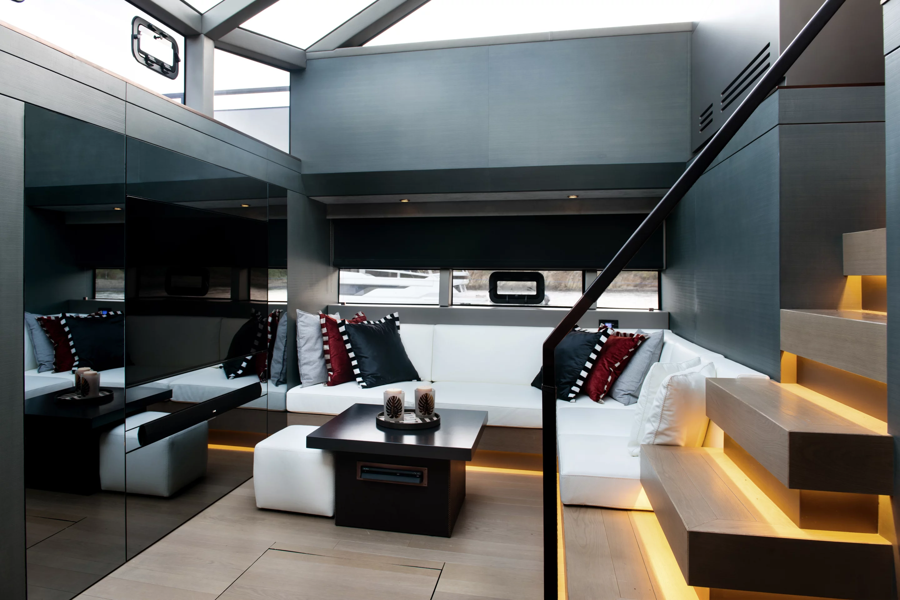 The lower living area benefits from an open-ceiling design that brings light directly from the glass above