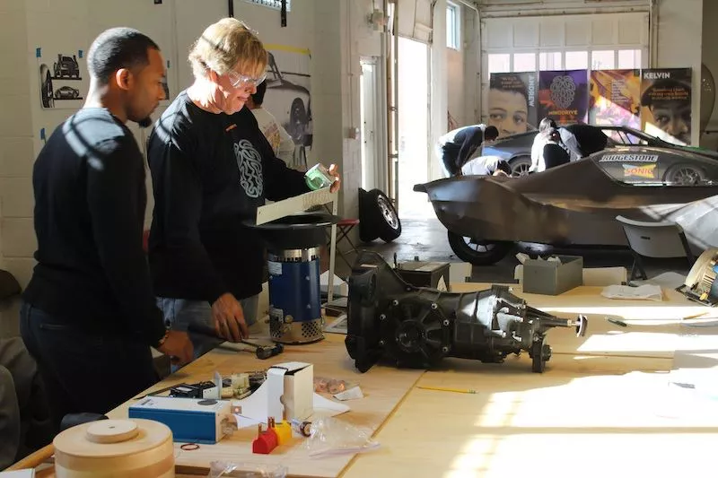 Steve Rees and mentor Elvis Butler check the components