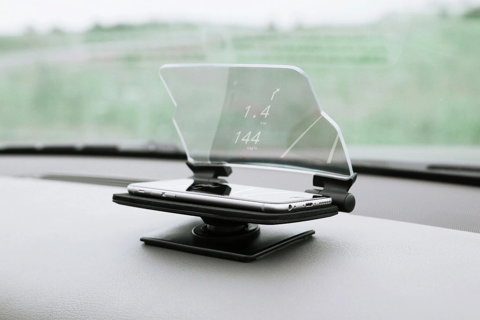 The Hudway Glass holds onto the phone thanks to magnets