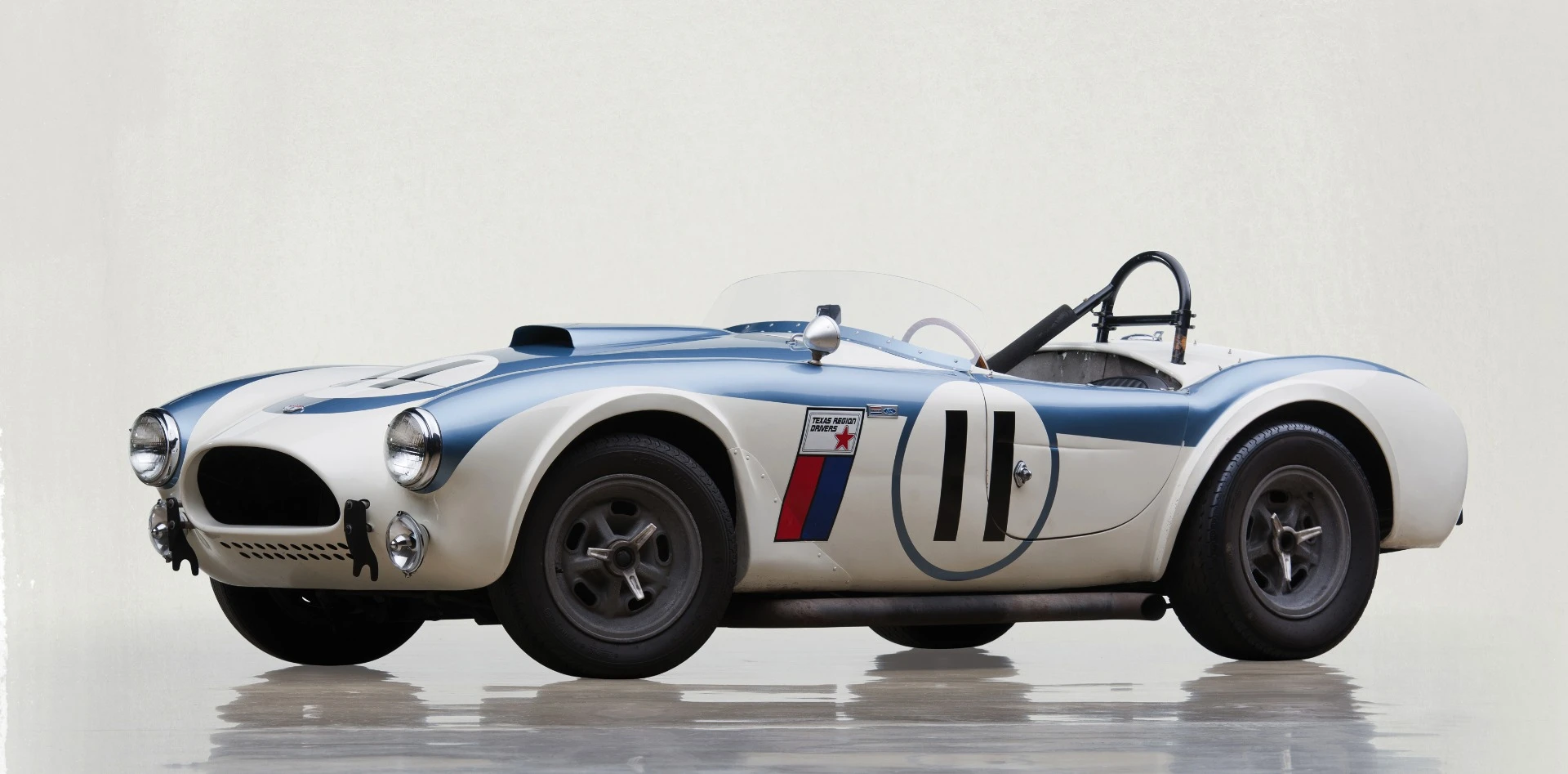 The first racing-specification Shelby Cobra sold to the public, this 1962 Shelby 289 Competition Cobra (Lot 237) boasts an estimated 340 bhp, from its 289 cu. in. The car was sold with an extensively well-documented ownership and race history, and presented in period livery