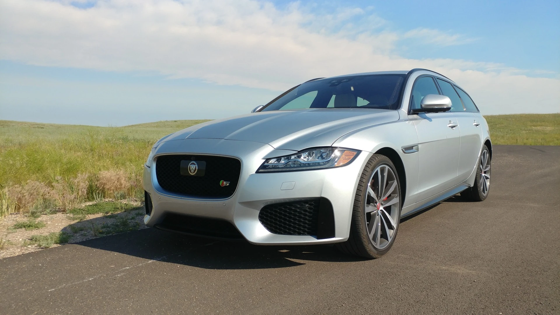 Heavy fenders are offset by thin lines and narrow headlamps in the Jaguar XF Sportbrake
