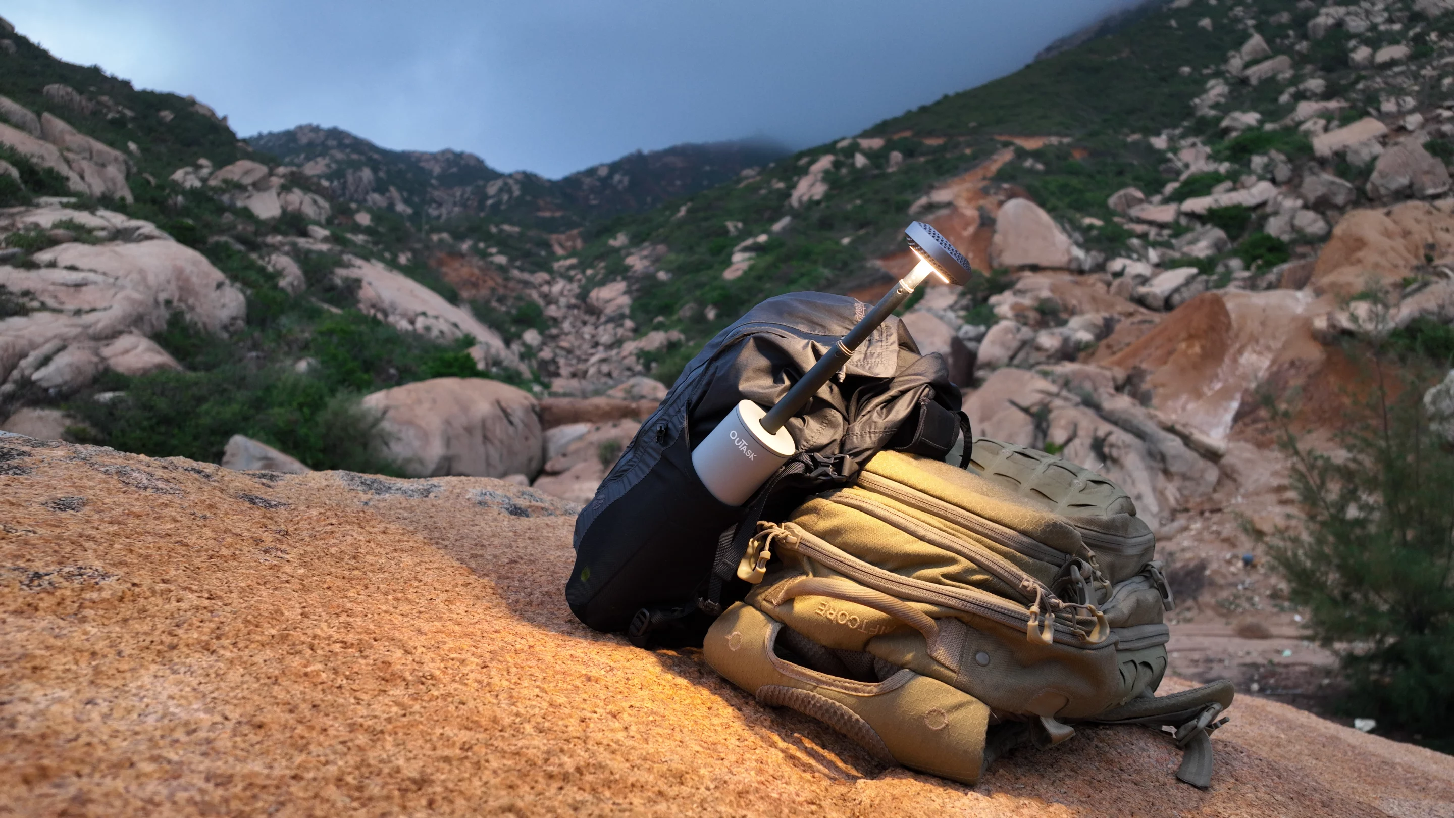 The ouTask lantern can be stowed in a backpack's bottle pocket, and the telescoping light head extended to illuminate the trail