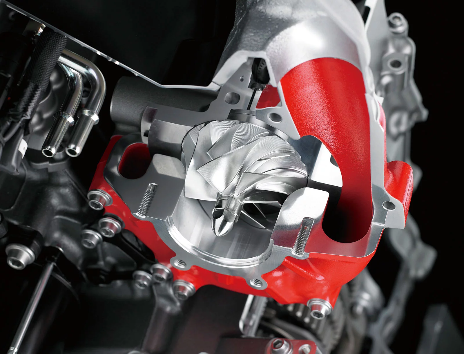 The supercharger used in the Ninja H2 was designed by Kawasaki motorcycle engine designers with assistance from other companies within the KHI Group, namely the Gas Turbine & Machinery Company, Aerospace Company, and Corporate Technology Division. Designing the supercharger in-house allowed it to be developed to perfectly match the engine characteristics of the Ninja H2. The highly efficient, motorcycle-specific supercharger was the key to achieving the maximum power and the intense acceleration that engineers wanted to offer.