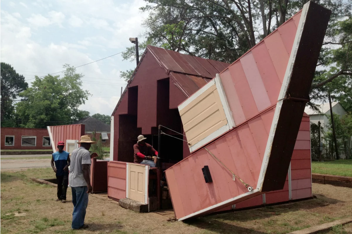 Open House by artist Matthew Mazzotta may look like a simple wooden home, but it actually folds open to create a unique outdoor theater