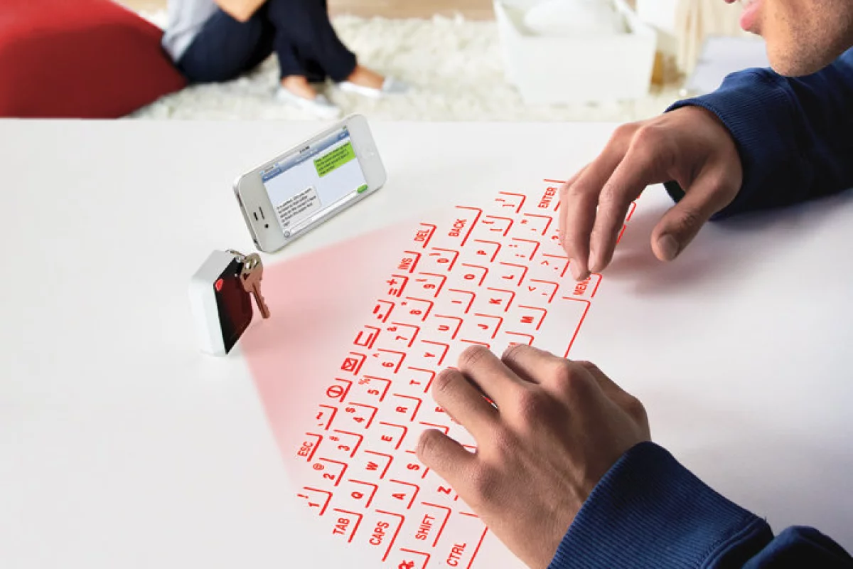 CTX's Virtual Keyboard projects a usable laser outline of a QWERTY keyboard onto any flat surface while fitting inside a small keychain
