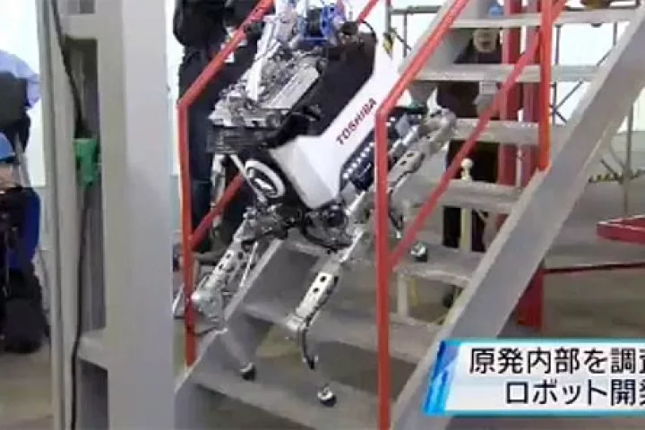 Toshiba's quadrupedal robot climbs stairs in a press demonstration (Photo: NHK)