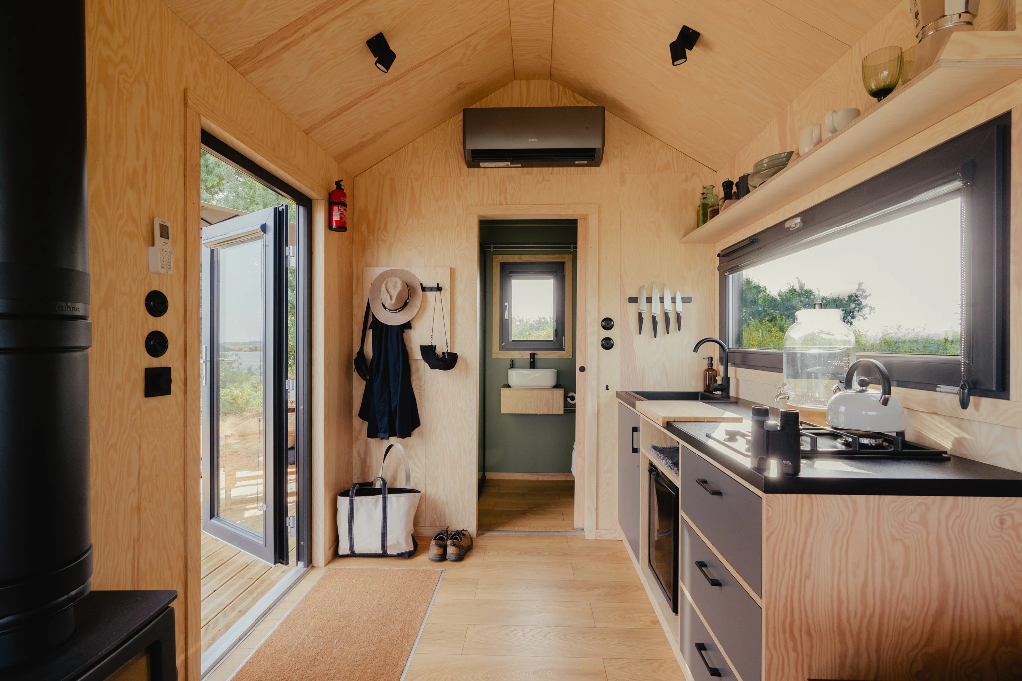 The interior of the tiny house is finished in plywood