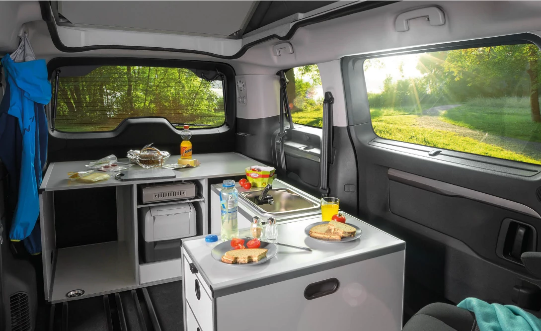 One of the coolest features of the Vanster is how the kitchen can be used inside and set up as an L with plenty of work space