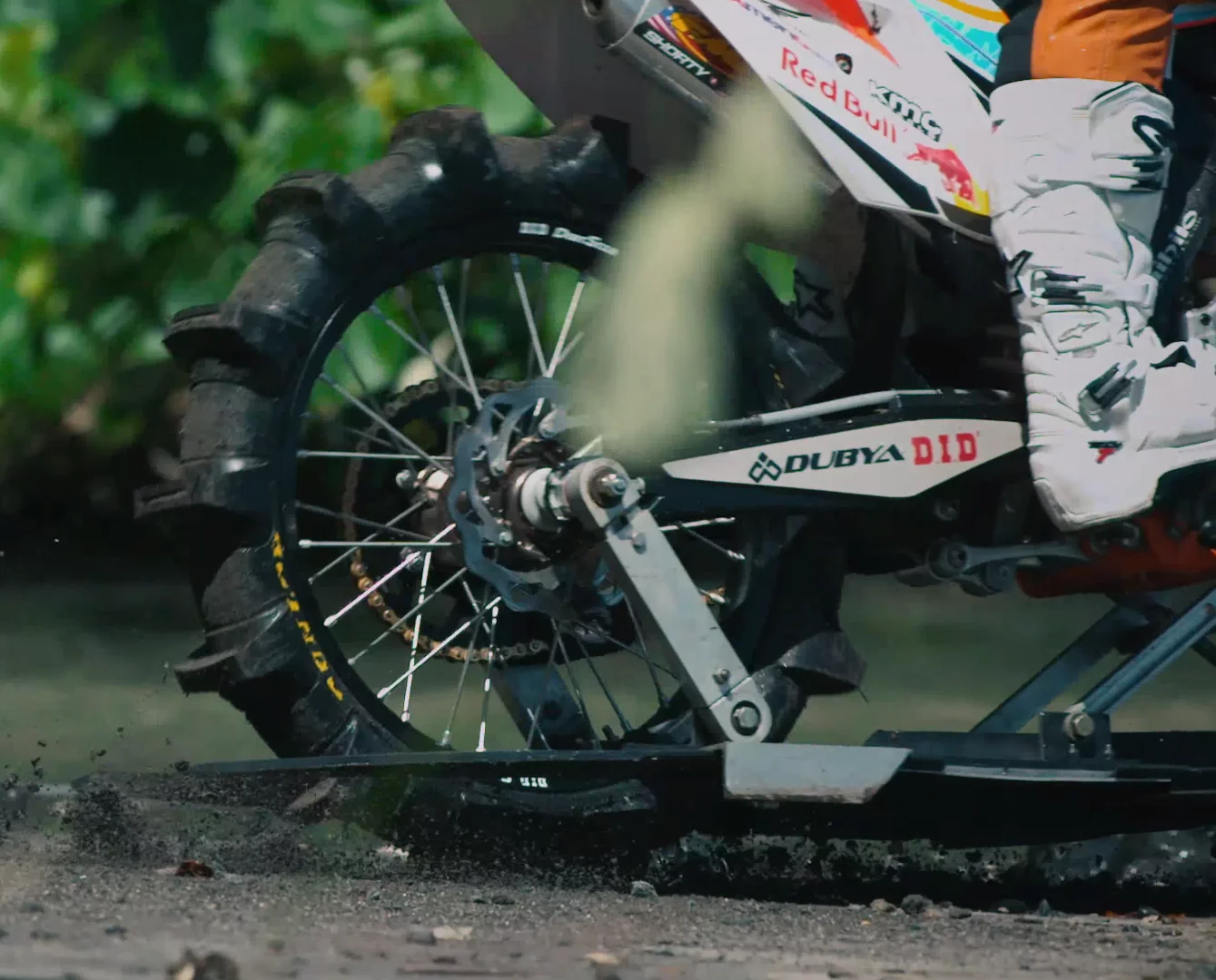 A close look at the rear wheel shows paddle tyres and small planing platforms to help the bike stay on top of the water at speed