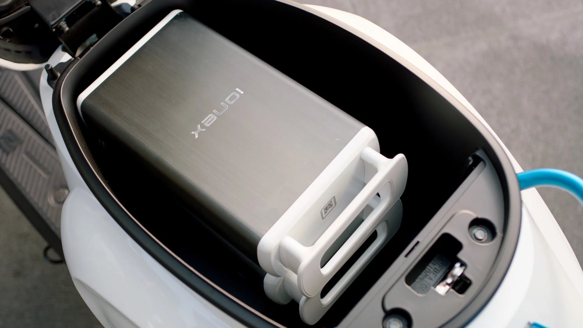 The underseat storage bay of the 2018 KYMCO Ionex can accommodate three extra batteries, or a lot of personal stuff