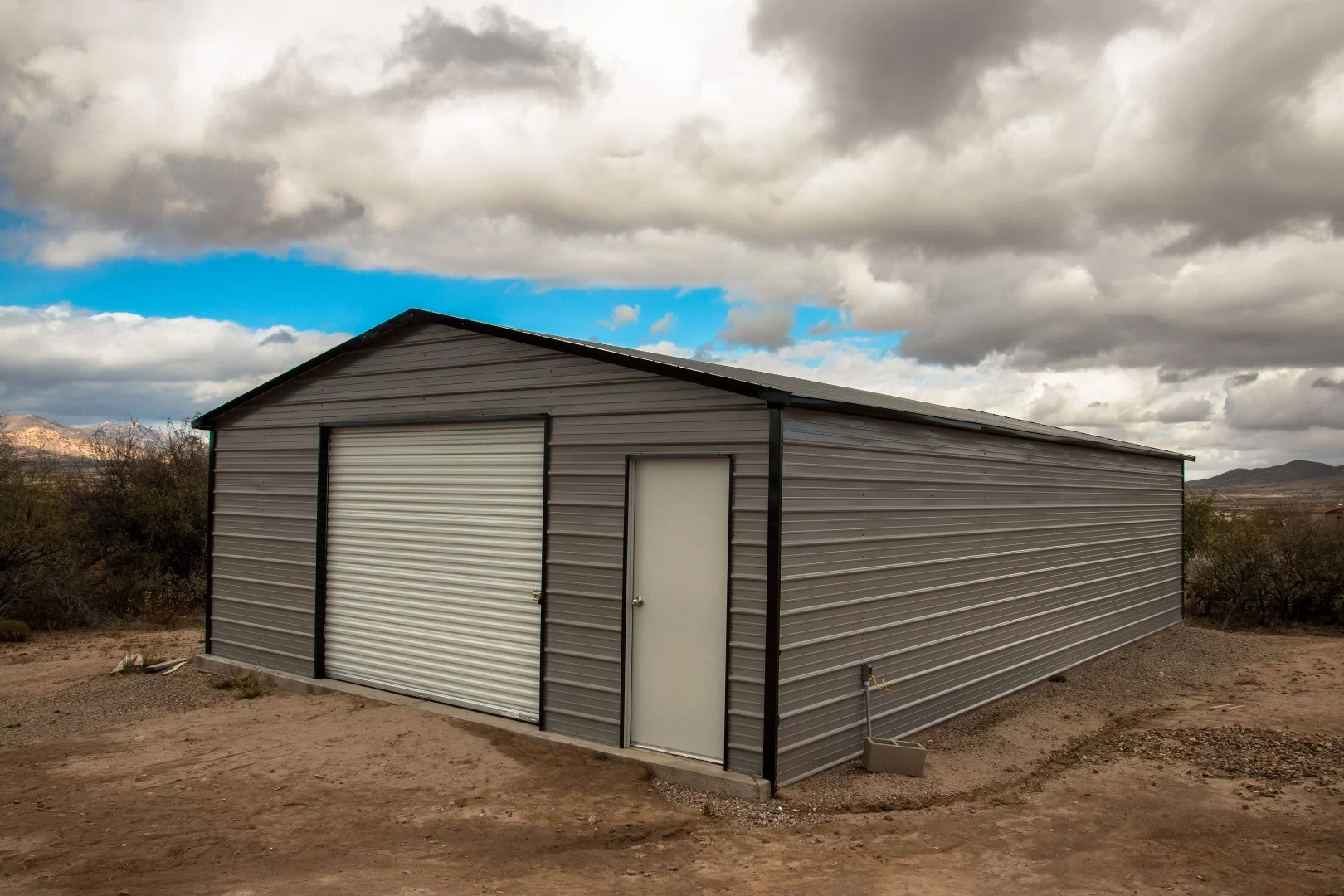 The garage. It is still unfinished as he ran out of concrete before he could floor it.