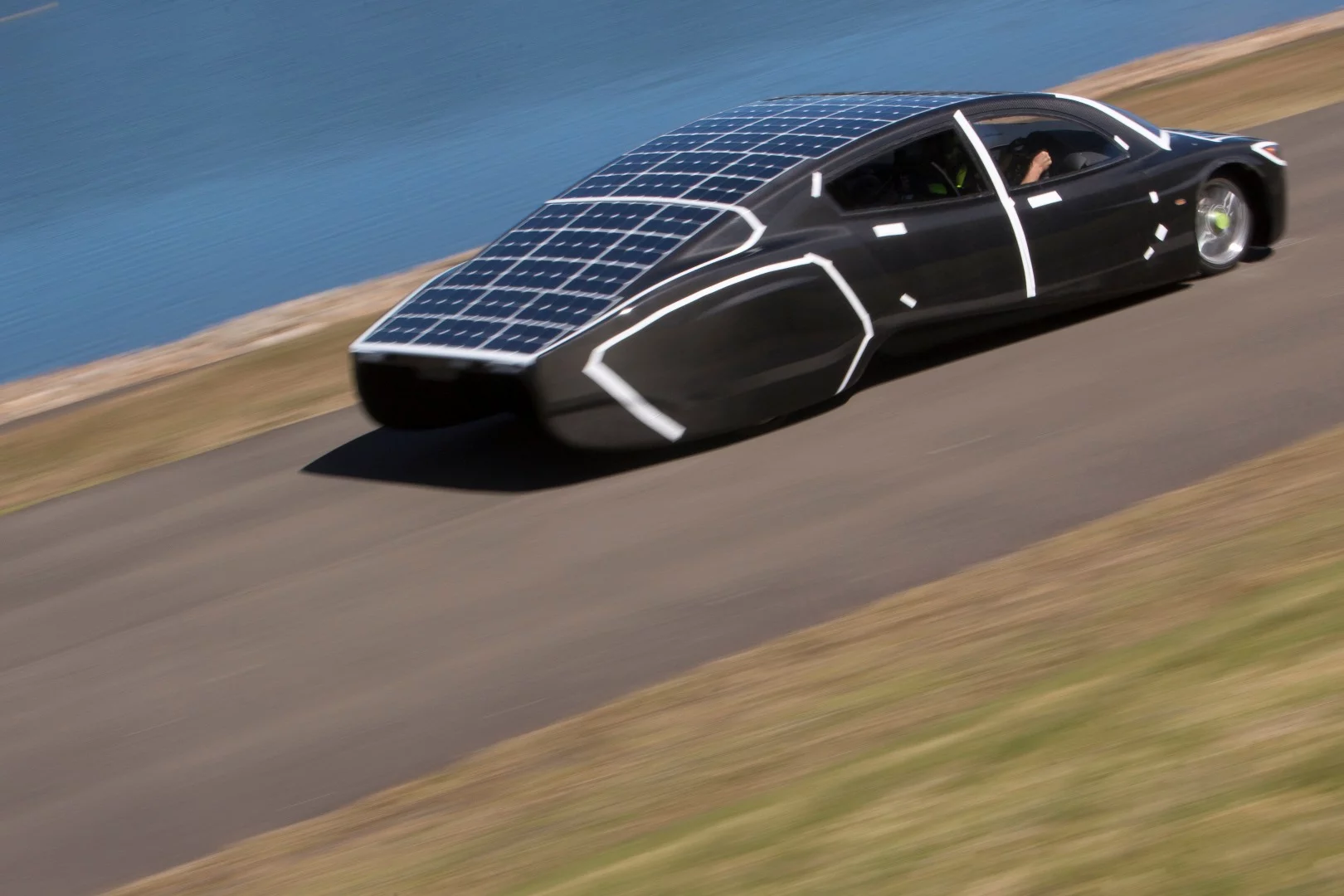 Upper surfaces of the Sunswift Violet electric sedan are covered in 284 microcrystalline solar cells