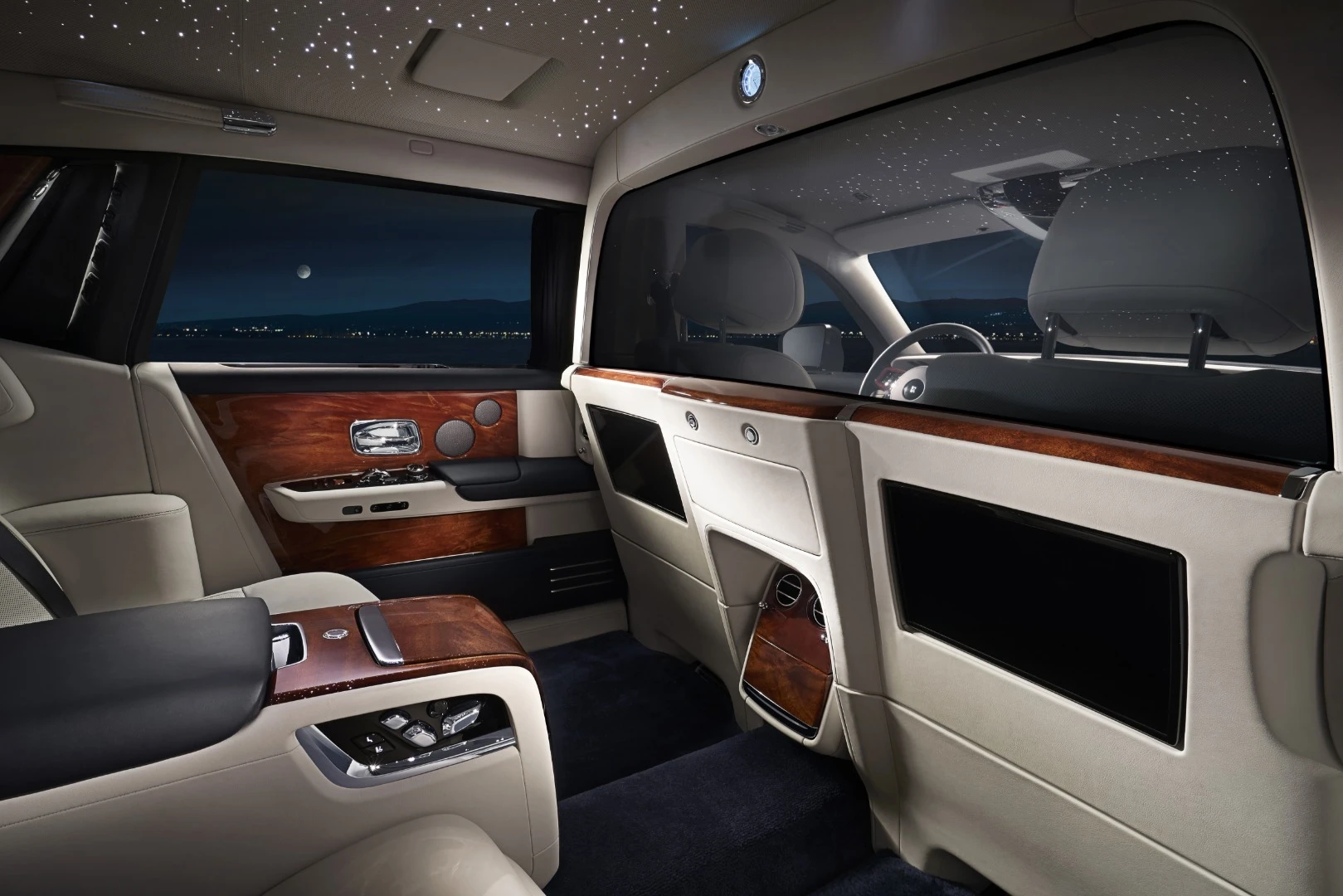 If documents or other high-falutin' whatnots need to be passed back to the passengers, this can be done via an illuminated "large aperture" between the two cabins