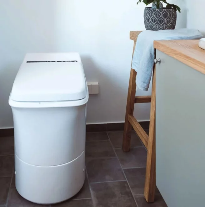 Norwegian-made Cinderella Comfort combustion toilet burns all waste to neutral ash and comes with an LCD display
