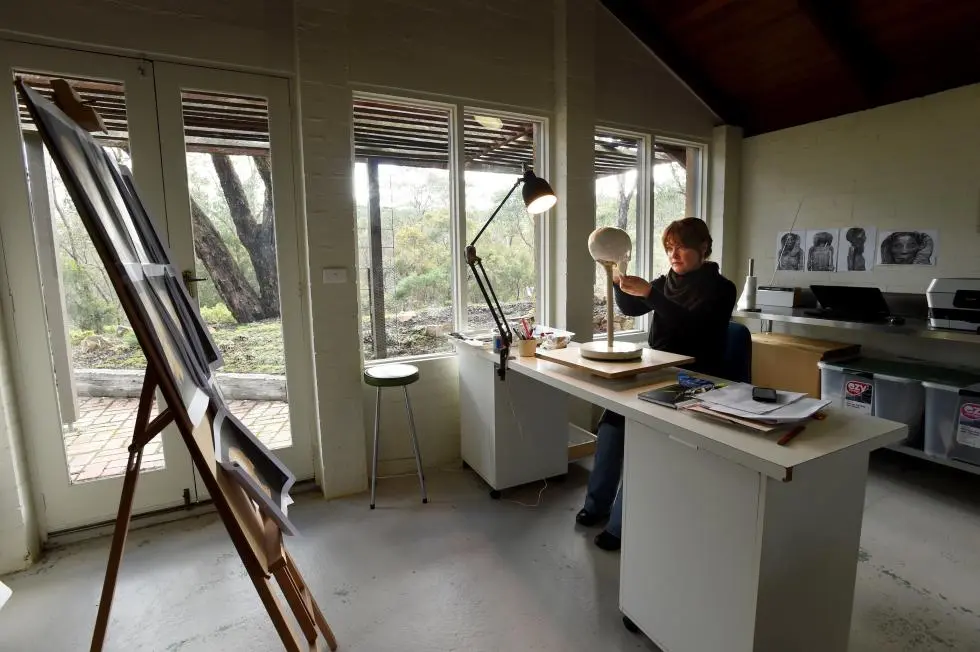 Sculptor Jennifer Mann working on Meritamun in her studio