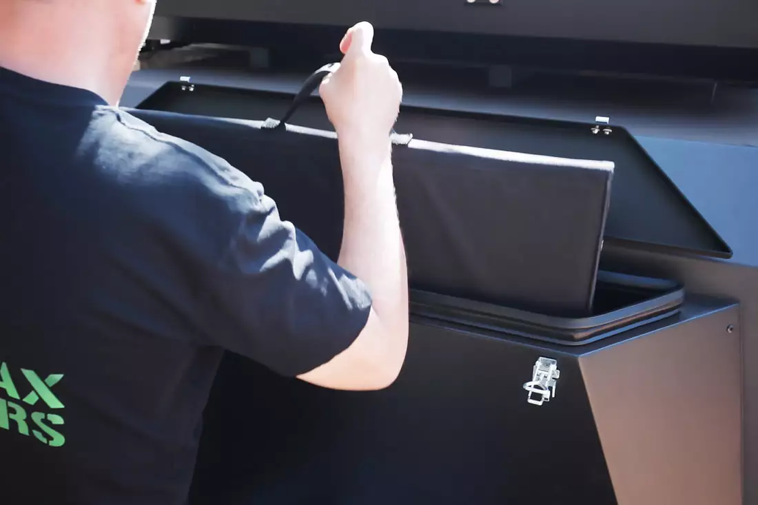 The main nose box is dedicated to the fridge, but this narrow compartment stores solar panels or other thin kit