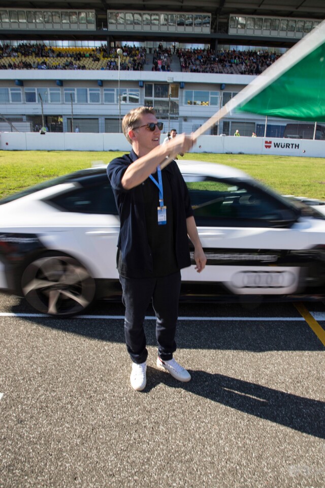 German national football team captain Bastian Schweinsteiger drops the flag to get the Audi RS 7 piloted driving concept underway