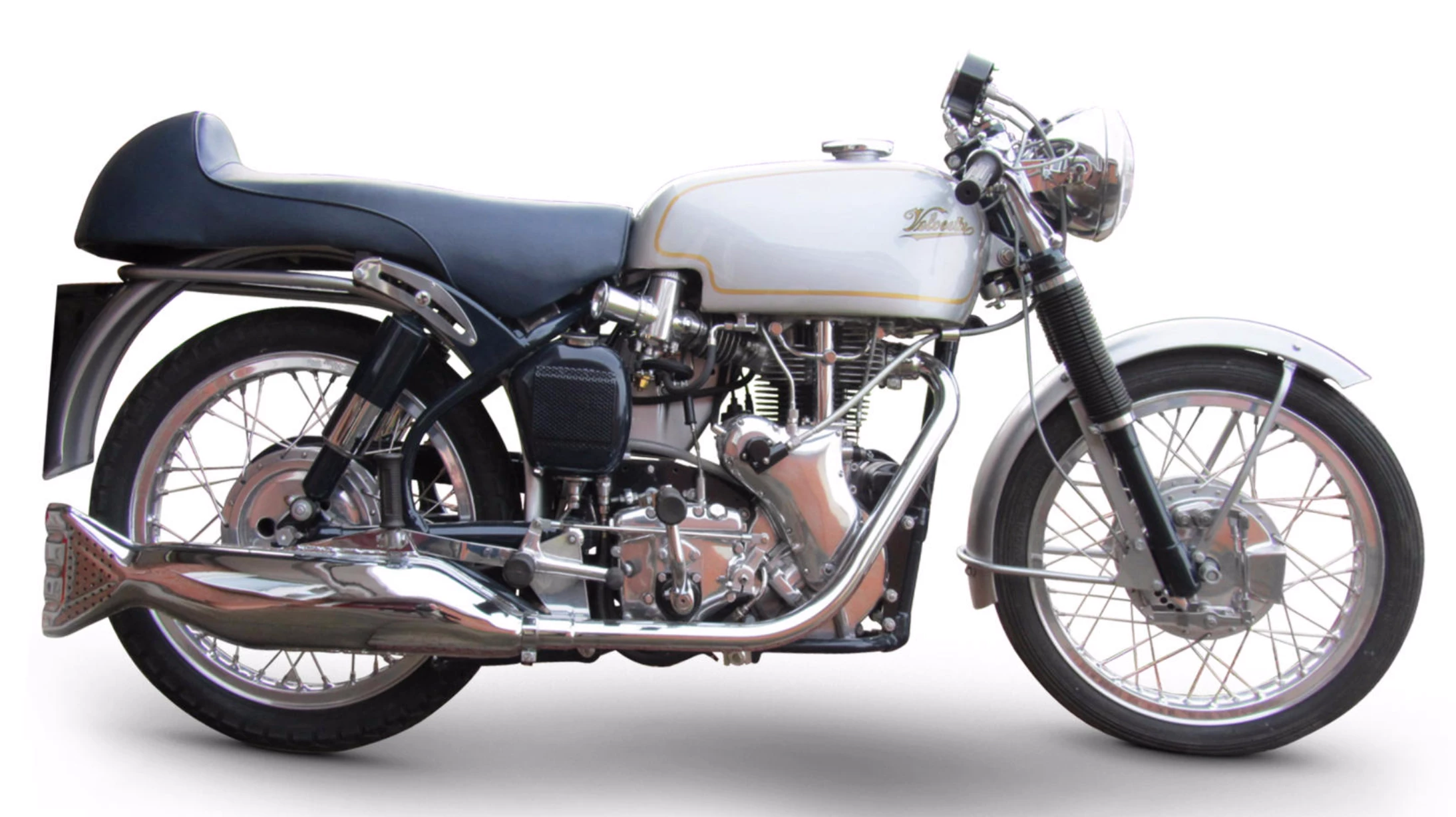 First produced in 1955, a production Velocette Venom set a motorcycle world record for 24-hours with an average speed of 100.05 mph (161.01 km/h) in 1961, becoming the first motorcycle of any capacity to break the "ton" over 24 hours. In 1964, an optional high-performance cylinder head was made available and a Venom equipped with the new head won its class in the 1964 Thruxton 500-mile race. The new cylinder head was then fitted to the new model named after the race victory and shown for the first time at the 1964 Earls Court Show, claiming 41 horsepower. This matching-numbers Thruxton Venom Velocette was for a time the ultimate cafe racer, and it is believed that between 1,100 and 1,200 were produced. The bike is expected to sell between £13,000 and 16,000 ($19,000 - 23,000)Auction Page