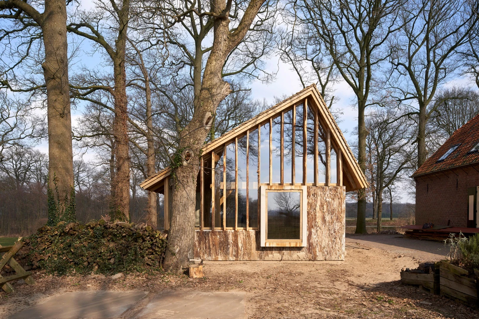 Deteriorating, century-old oak trees destined for the scrapheap have been worked into a lovely barn in the Netherlands