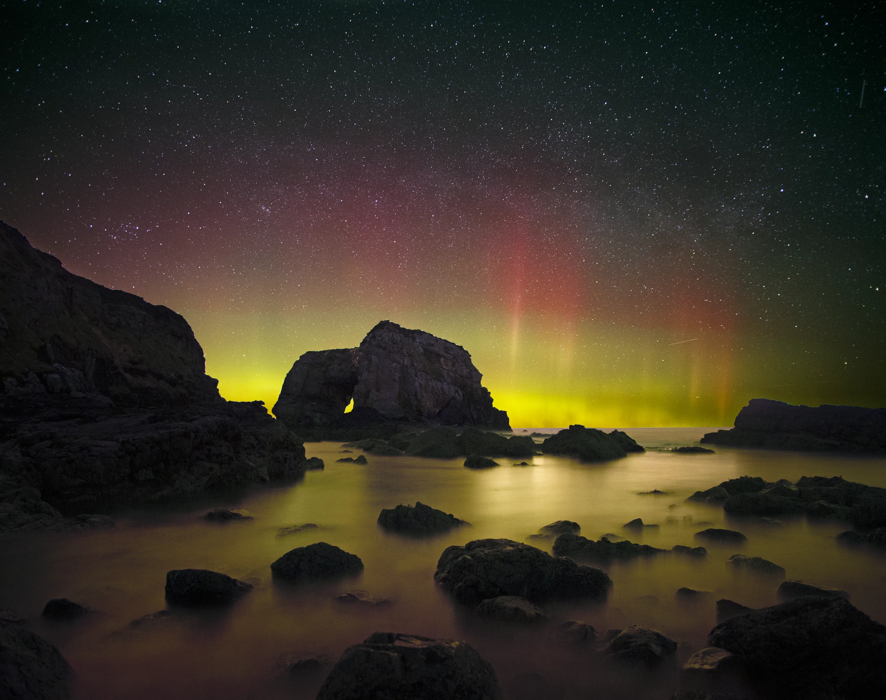 Aurora Over the Great Pollet Sea Arch by Brendan Alexander, taken in County Donegal, Ireland. Shortlisted in the Aurora category