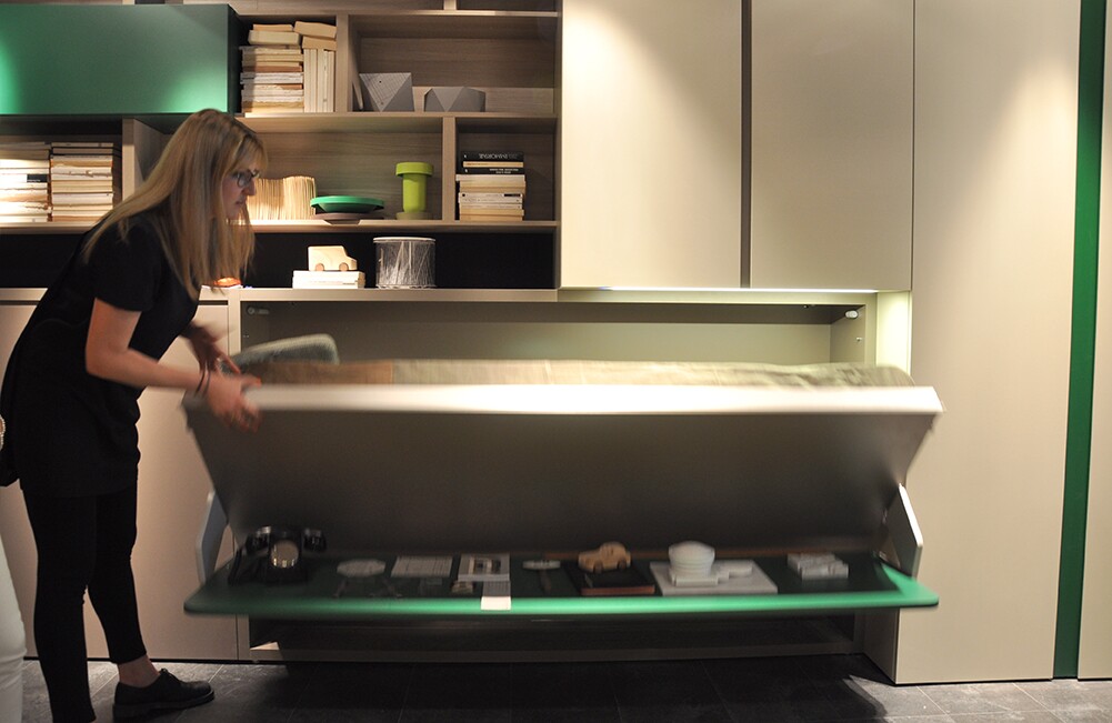 The table top remains horizontal at all times, meaning there is no need to remove items from top when folding down the bed