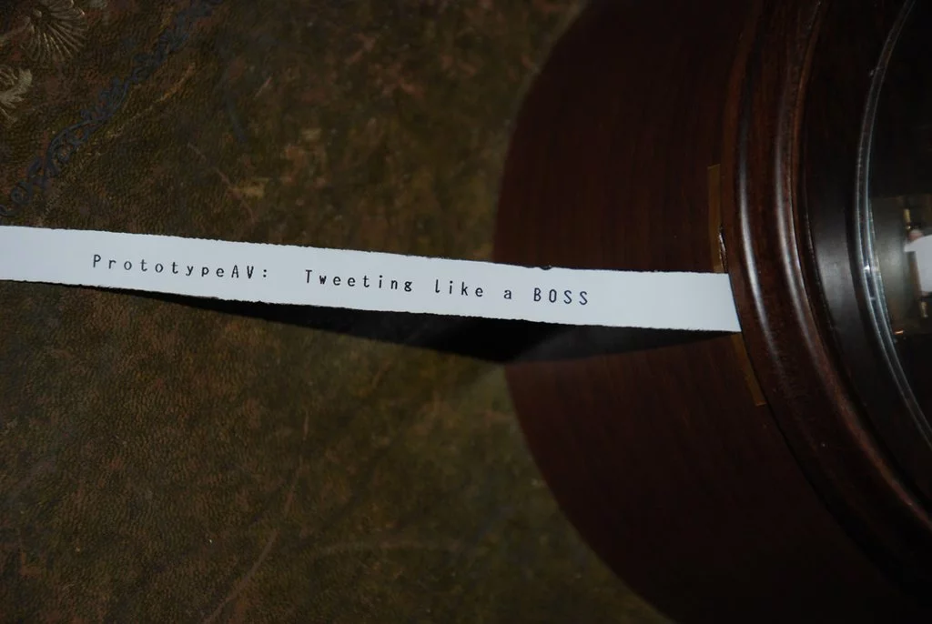 New Tweets are printed out onto a roll of cut-down thermal till receipt paper using a tiny thermal printer hidden in the base