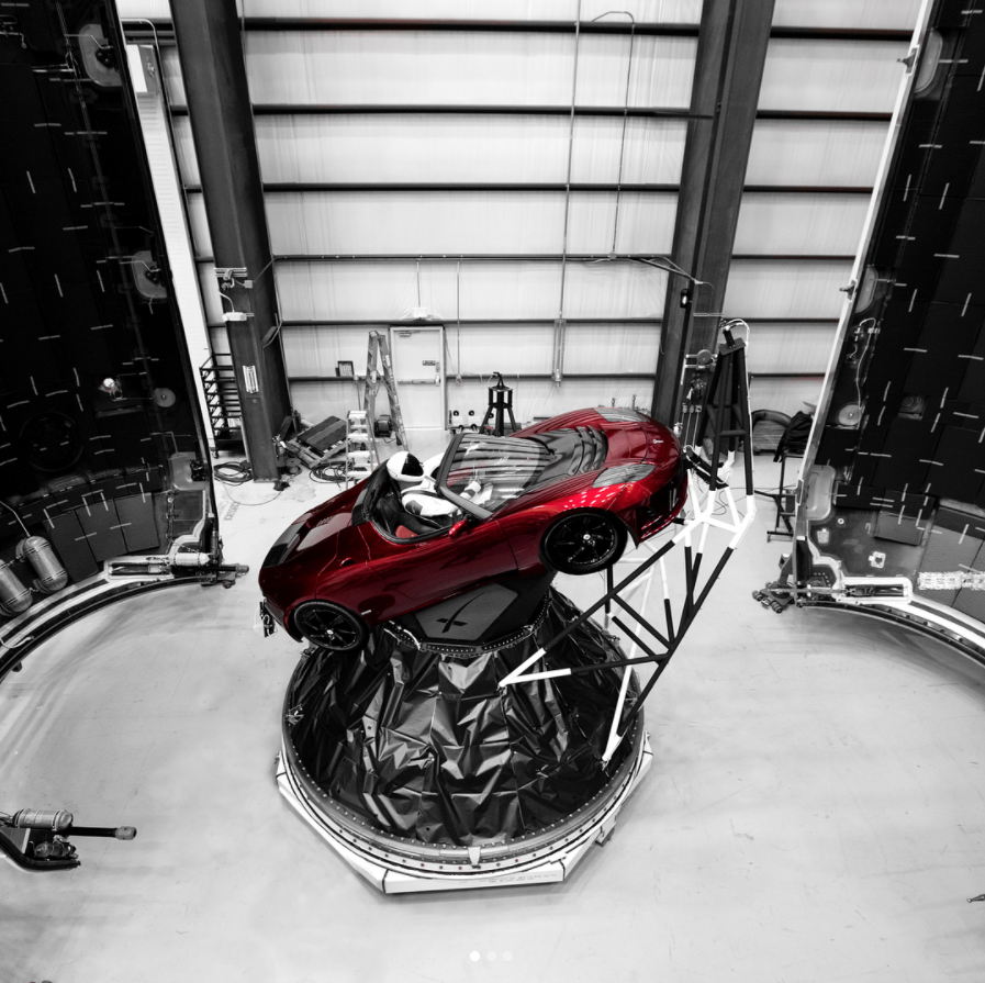 A dummy sits in Elon Musk's Tesla Roadster, headed for Mars