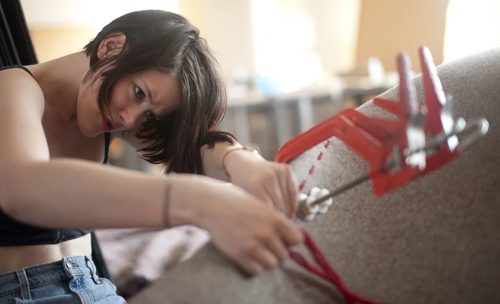 HUSH is sewn by hand with 150 meters (490 feet) of wool yarn