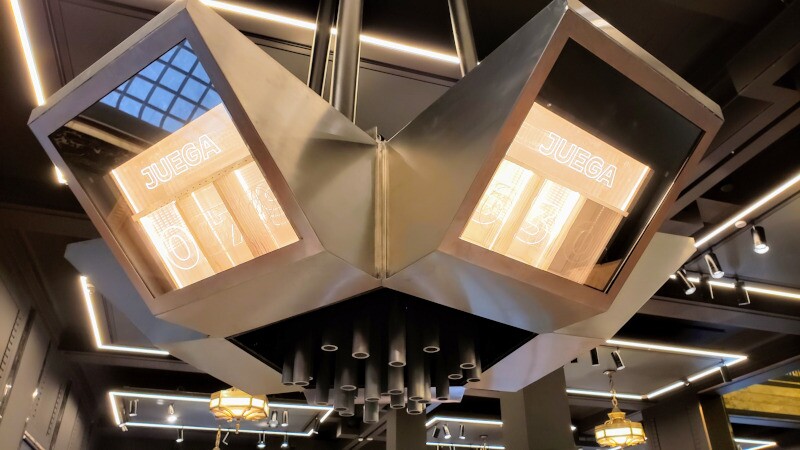 Game overhead section with edge-lit acrylic score display and musical chimes